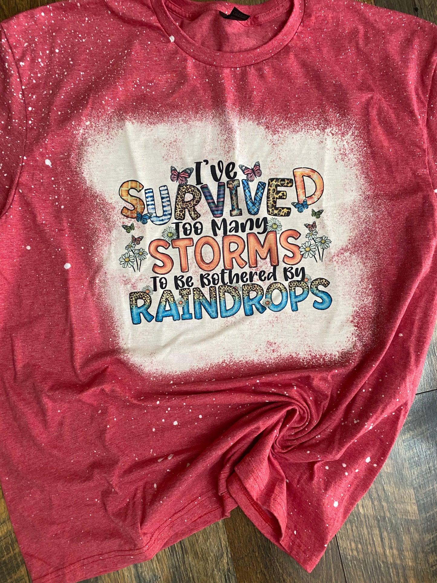 I SURVIVED TOO MANY STORMS BLEACHED T-SHIRT